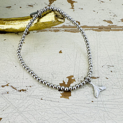 Kugelarmband mit Walflosse
